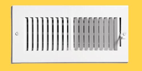 heating vent on yellow wall
